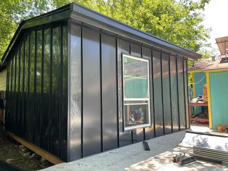 Black standing seam metal wall panels for Roof Inspection in Norwich