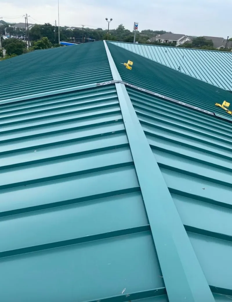 Green commercial metal roof ridge and valley for Metal Roof Repair in Norwich